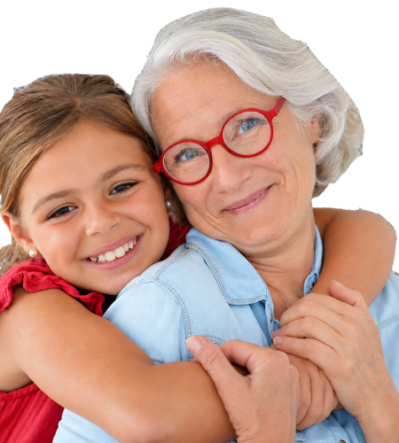 Grandmother and granddaughter smiling and embracing